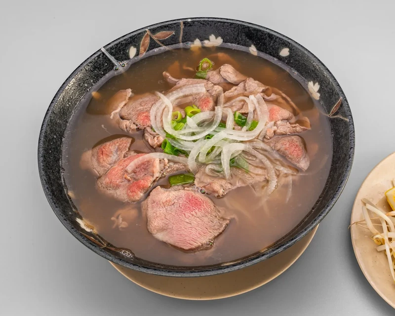 Beef Pho with tender beef slices in traditional beef broth at Bon Vietnamese Cuisine, Redstone, Calgary