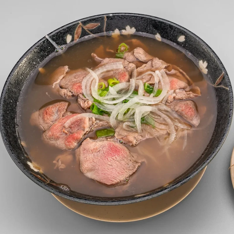 Beef Pho with tender beef slices in traditional beef broth at Bon Vietnamese Cuisine, Redstone, Calgary